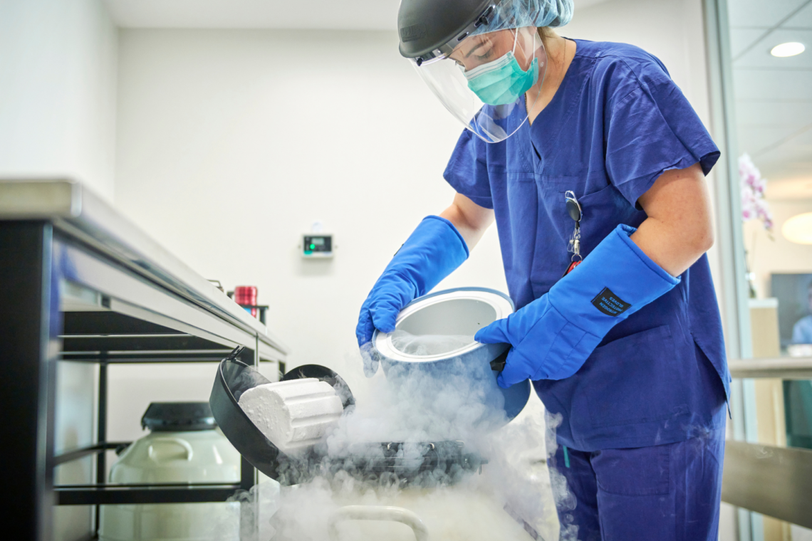 Scientist handling liquid nitrogen at IUI clinic